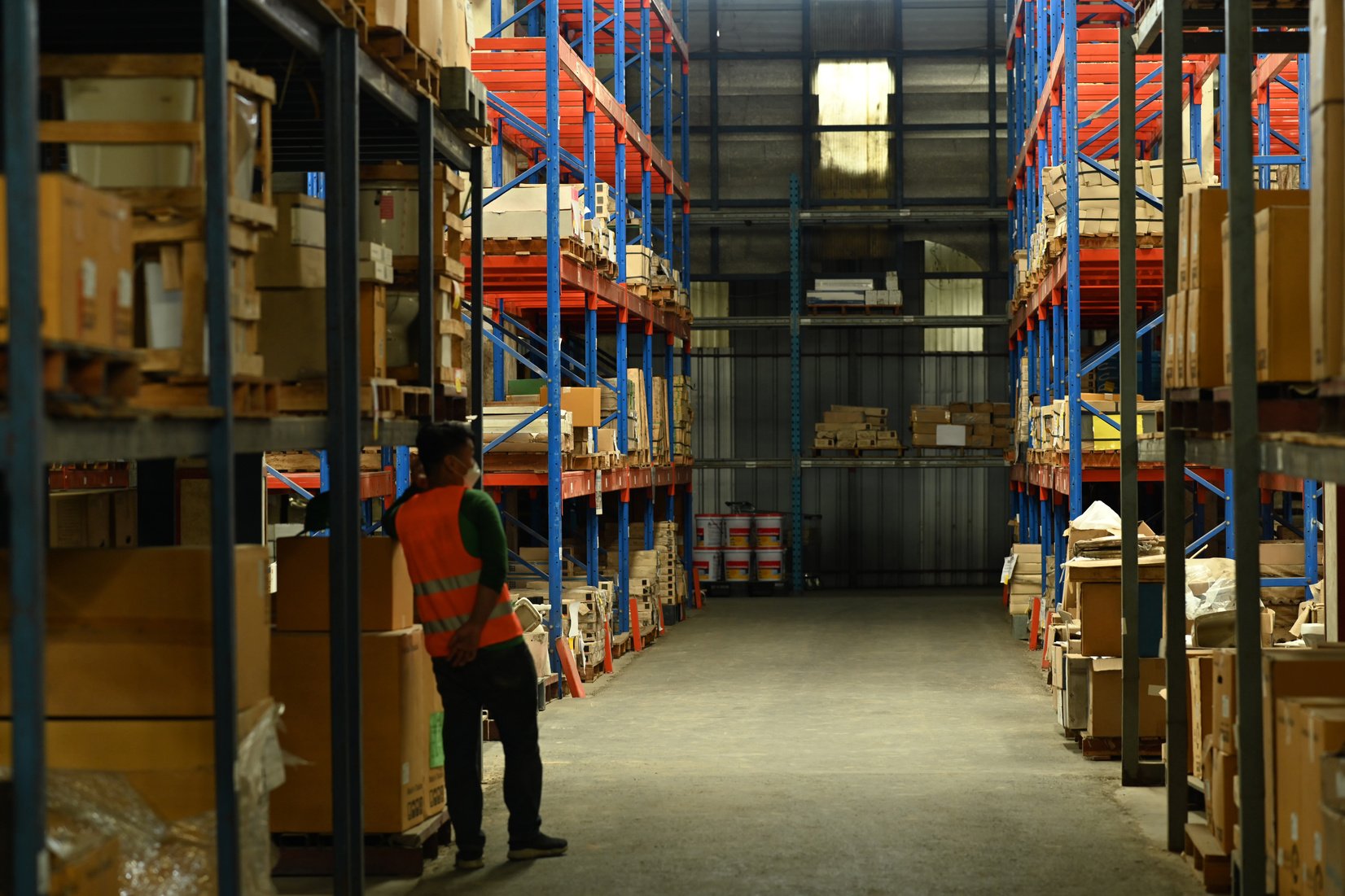 Warehouse workers wearing safety hardhat working on retail wareh